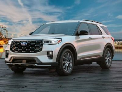 A 2026 Ford Explorer SUV parked on a pier near an amusement park