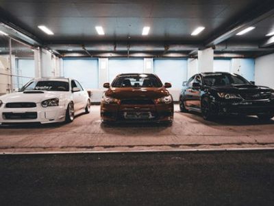 Luxury cars parked long-term in indoor garages