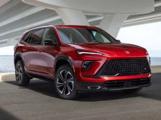 Bold red Buick SUV: modern design, premium comfort, and versatile performance for coastal drives.