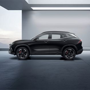 A black Jetour Dsashing in a modern, minimalist indoor space.