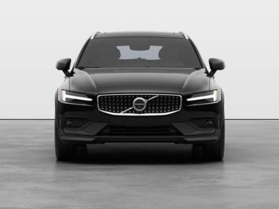 Front view of a black Volvo SUV, featuring its signature Thor's hammer LED headlights and distinctive grille emblem in a clean studio setting.