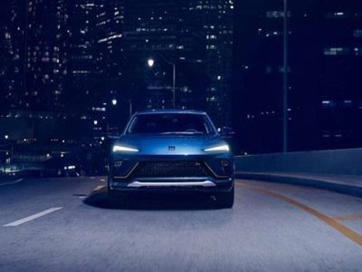 Sleek blue electric SUV: bold design, dynamic performance, and futuristic style for urban night drives.