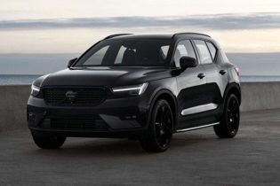 Sleek Volvo XC40: bold black design, premium safety tech, and versatile performance for urban and coastal drives.