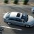 A silver corolla 2024 with a sunroof driving on the road.