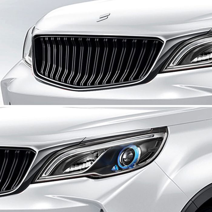 Close - up of a white car's grille and headlight.