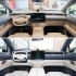 Comparison of two car interiors, one with a beige and gray color scheme and the other with a blue and white color scheme, both featuring large central screens.
