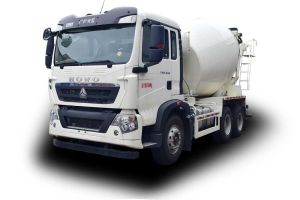 A white HOWO concrete mixer truck with a large rotating drum.