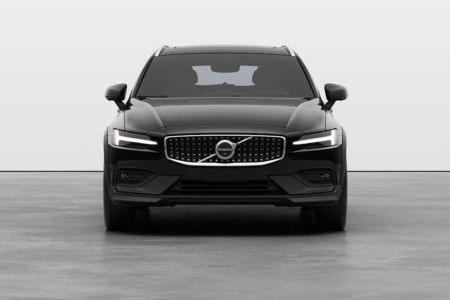 Front view of a black Volvo SUV, featuring its signature Thor's hammer LED headlights and distinctive grille emblem in a clean studio setting.