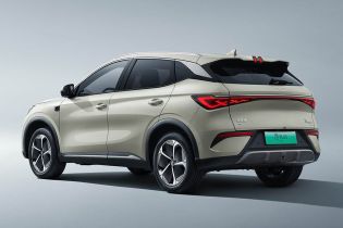 Side and rear view of a light-colored BYD Yuan Plus electric SUV.