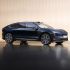 Side view of a dark blue NIO ET9 electric car in a studio setting.