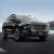A black Jetour X70 Plus SUV driving on the road.