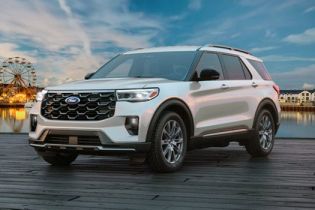 A 2026 Ford Explorer SUV parked on a pier near an amusement park