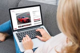 Browse cars online using a laptop