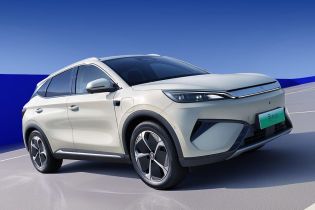 A light - colored BYD Yuan Plus electric SUV parked on the road.