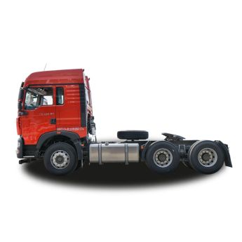 Side view of a red heavy - duty truck tractor unit, isolated on a white background.