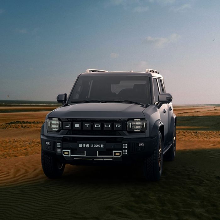 2025 Jetour Traveller SUV parked on sandy terrain.