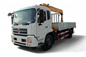 A white truck with a yellow crane mounted on its bed.