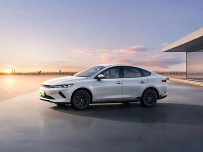 BYD electric sedan: Sleek white design, eco-friendly performance, and modern style for coastal drives.