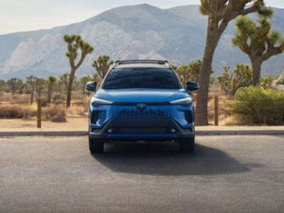 Bold blue Toyota SUV: rugged design, reliable performance, and adventure-ready for desert landscapes.