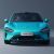 Front view of a turquoise Xiaomi SU7 car.