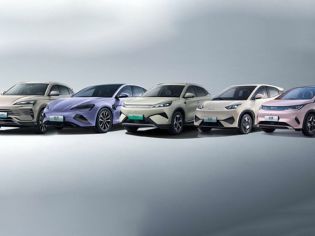 A lineup of five BYD electric cars in different colors.