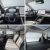Four images showing the interior of a BYD Yuan Plus electric SUV, including the dashboard, seats, and trunk space.