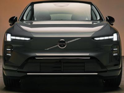 Head-on shot of new Volvo EX60 EV smooth front fascia with emblem