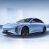 The Xinghai S7, a light blue electric sedan with a sleek design, black wheels, and a modern aesthetic, showcased against a minimalist, light blue background.