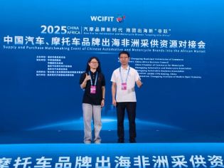 Two people posing at the Supply and Purchase Matchmaking Event of Chinese Automotive and Motorcycle Brands into the African Market.