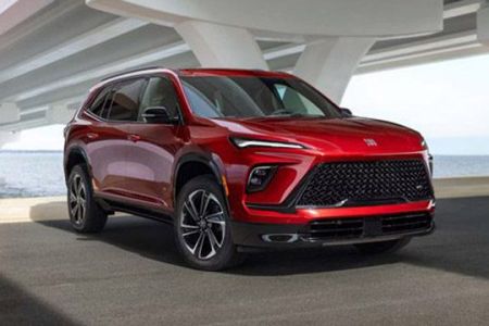 Bold red Buick SUV: modern design, premium comfort, and versatile performance for coastal drives.