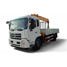 A white truck with a yellow crane mounted on its bed.