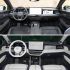 Comparison of two Volkswagen car interiors, one with a dark color scheme and the other with a light color scheme, both featuring large central screens.