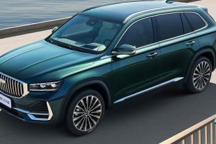 A dark green Geely SUV by the water.