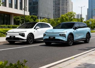 Two XPeng EVs (white G9, light blue G7) parked on a city street, modern buildings and greenery in the background.