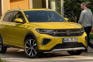Bright yellow Volkswagen SUV (with VW logo, alloy wheels) parked by a building; a man walks beside it.