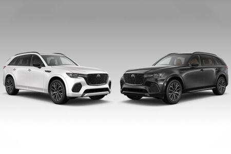 Side-by-side view of a 2025 Mazda CX-70 against a CX-90 background, showcasing contrasting color options