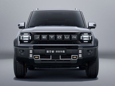 The 2025 Jetour Traveler SUV, in a sleek gray finish, features a bold front design with prominent "JETOUR" branding and rugged off-road elements, showcased against a minimalist gray backdrop.