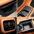 Four views of a car's interior details, including door storage, control buttons, air vent, and open center console.