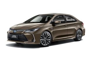 A brown Toyota Corolla sedan.