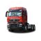 Front - side view of a red HOWO truck tractor unit, isolated on a white background.
