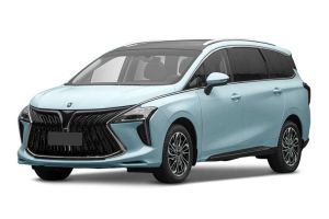 A light blue MPV with a bold front grille and panoramic sunroof is showcased against a plain background, highlighting its modern and spacious design.