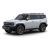 A white off - road SUV with bronze - colored wheels.