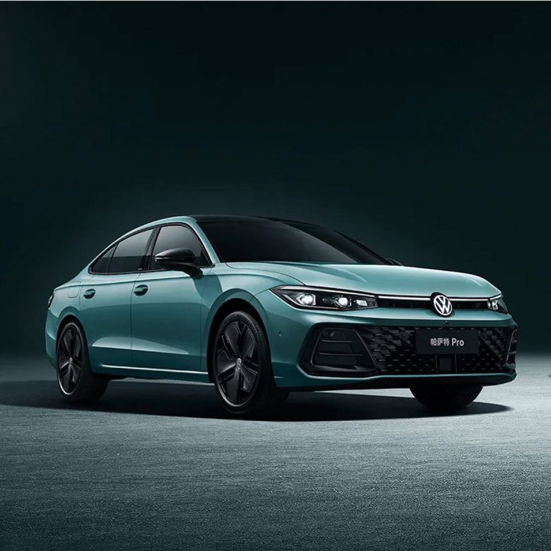 A teal Volkswagen Passat Pro sedan.