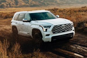 A 2026 Toyota Sequoia driving on a muddy road