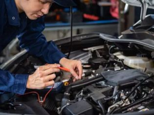 Automotive inspectors inspect engines