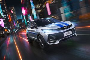 A Geely BinYue L SUV with blue stripes driving through a vibrant, neon - lit city at night.