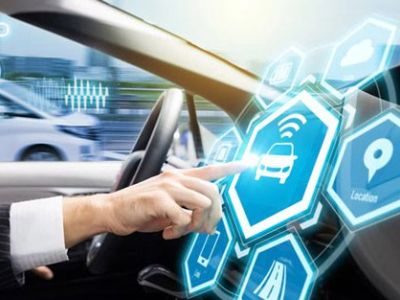 Connected car tech: Driver interacting with holographic infotainment icons, including car status, Wi-Fi, and navigation, in a futuristic cockpit.
