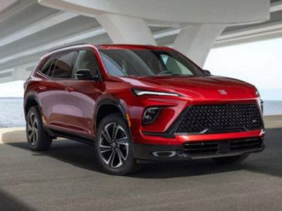 Bold red Buick SUV: modern design, premium comfort, and versatile performance for coastal drives.