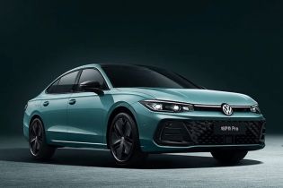 A teal Volkswagen Passat Pro sedan.