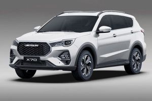 The Jetour X70 SUV, in a sleek white finish, features a bold grille, modern headlights, and stylish alloy wheels, embodying a blend of rugged design and urban sophistication.
